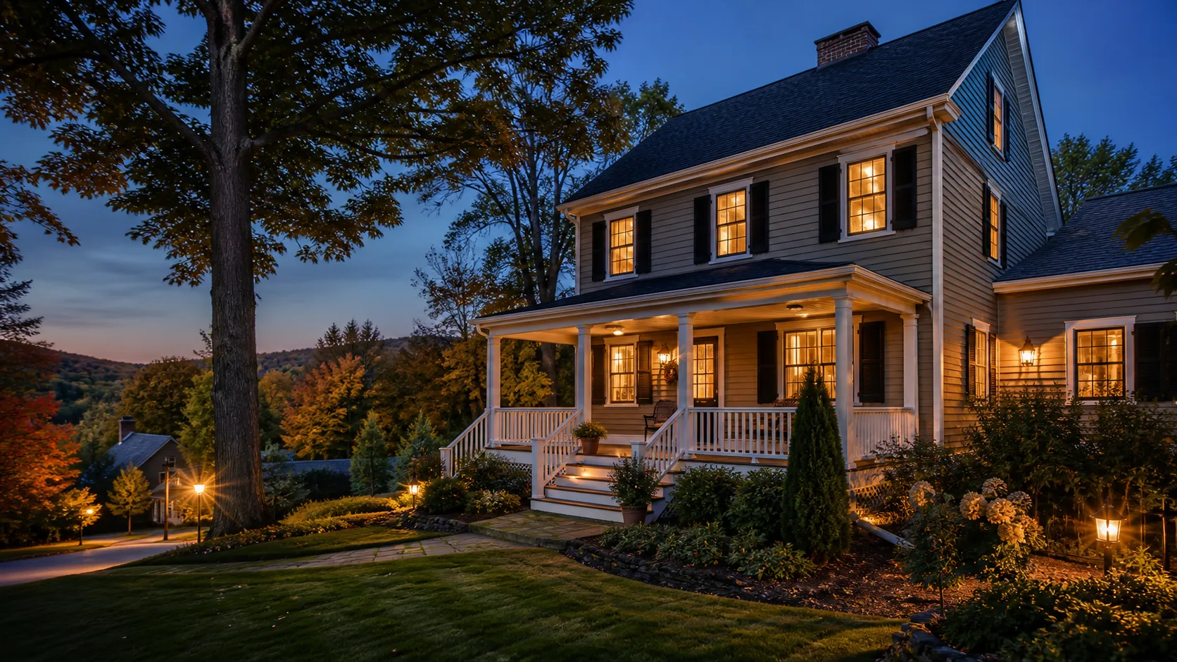 Warmly lit New England home in western Connecticut at dusk