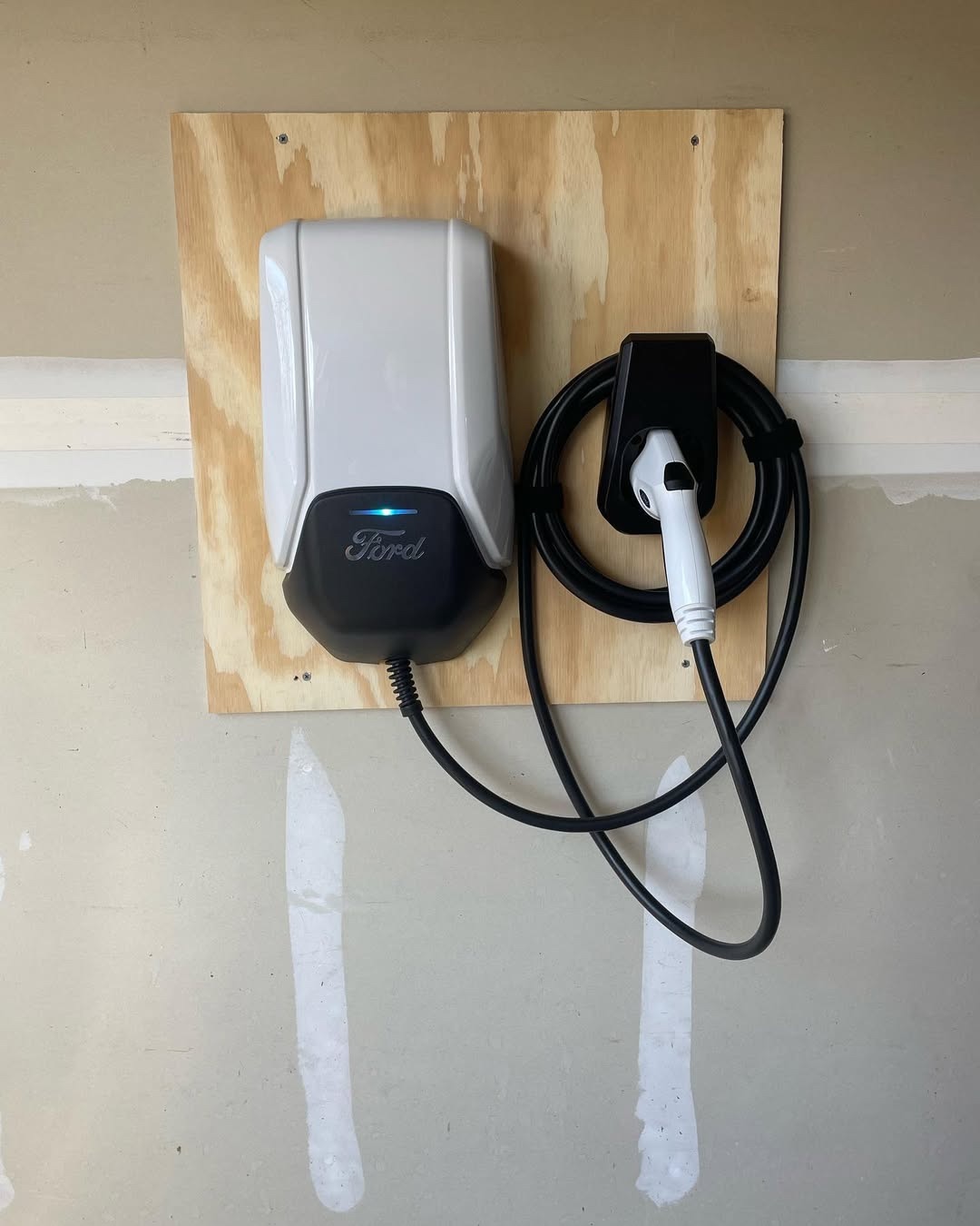 Ford home EV charger installed on a garage wall