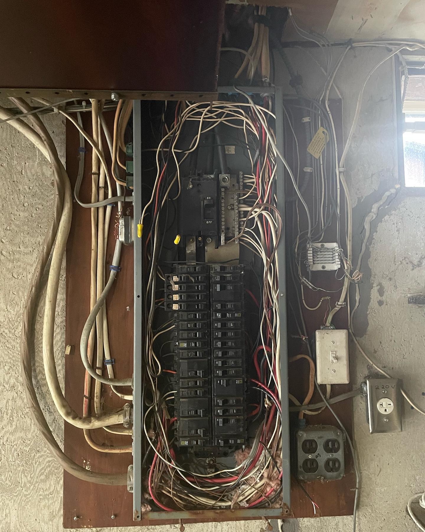 Electrical panel before TLA Electric organized and upgraded the wiring